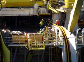 Workers lay a Nexans interconnector power cable in the North Sea