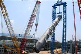Netherlands-headquartered Roll Group said it focuses on delivering end-to-end solutions. Here, it was working at a Lotte Chemical Indonesia plant1,250 tonne crawler crane tails the upending of the column by Roll Lift using its unguyed heavy lift gantry system