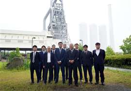 A group of Denzai and Kurogane suits on an industrial site