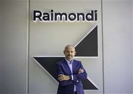 Mauro Masetti in front of the Raimondi logo