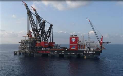 Both of Sleipnir's 10,000 tonne cranes installing the Leviathan topsides