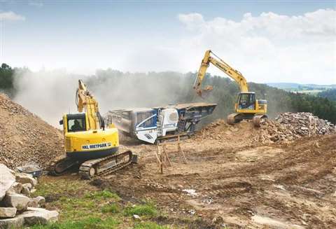 The two excavators provided by HKL on site in Austria with a mobile rock crusher